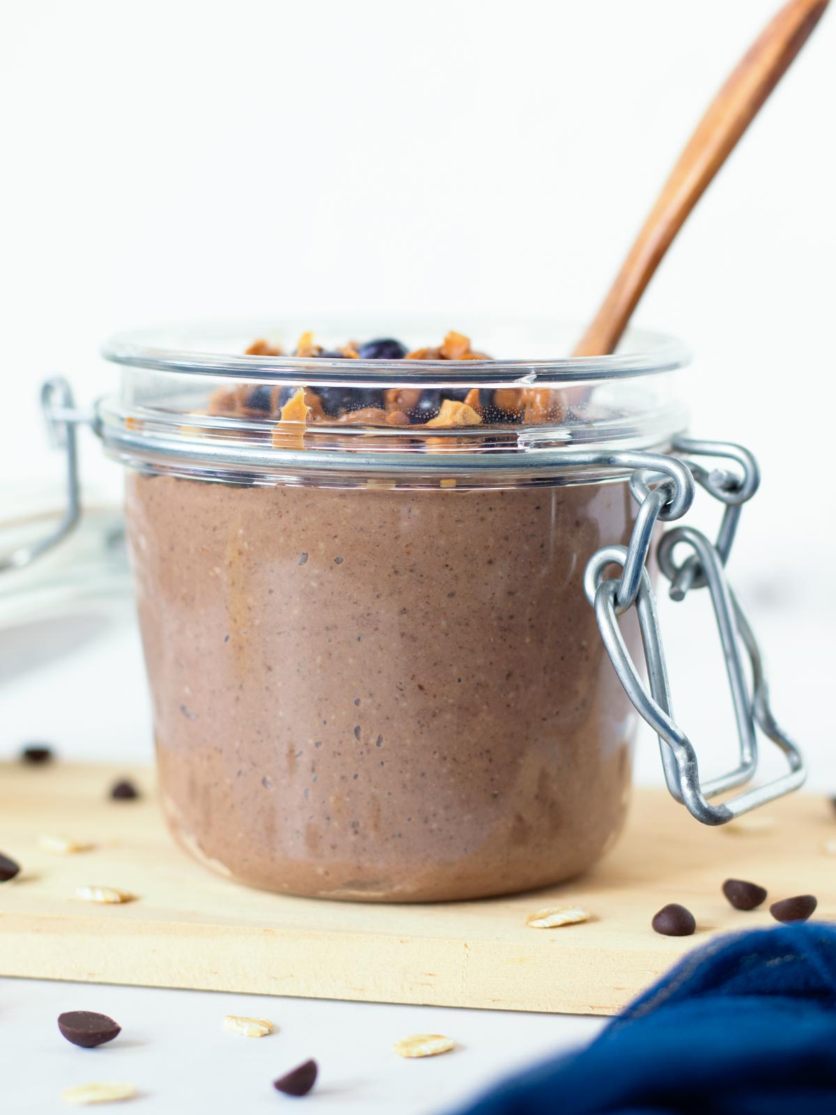 Cold overnight oats with blended oats in a jar with wooden spoon