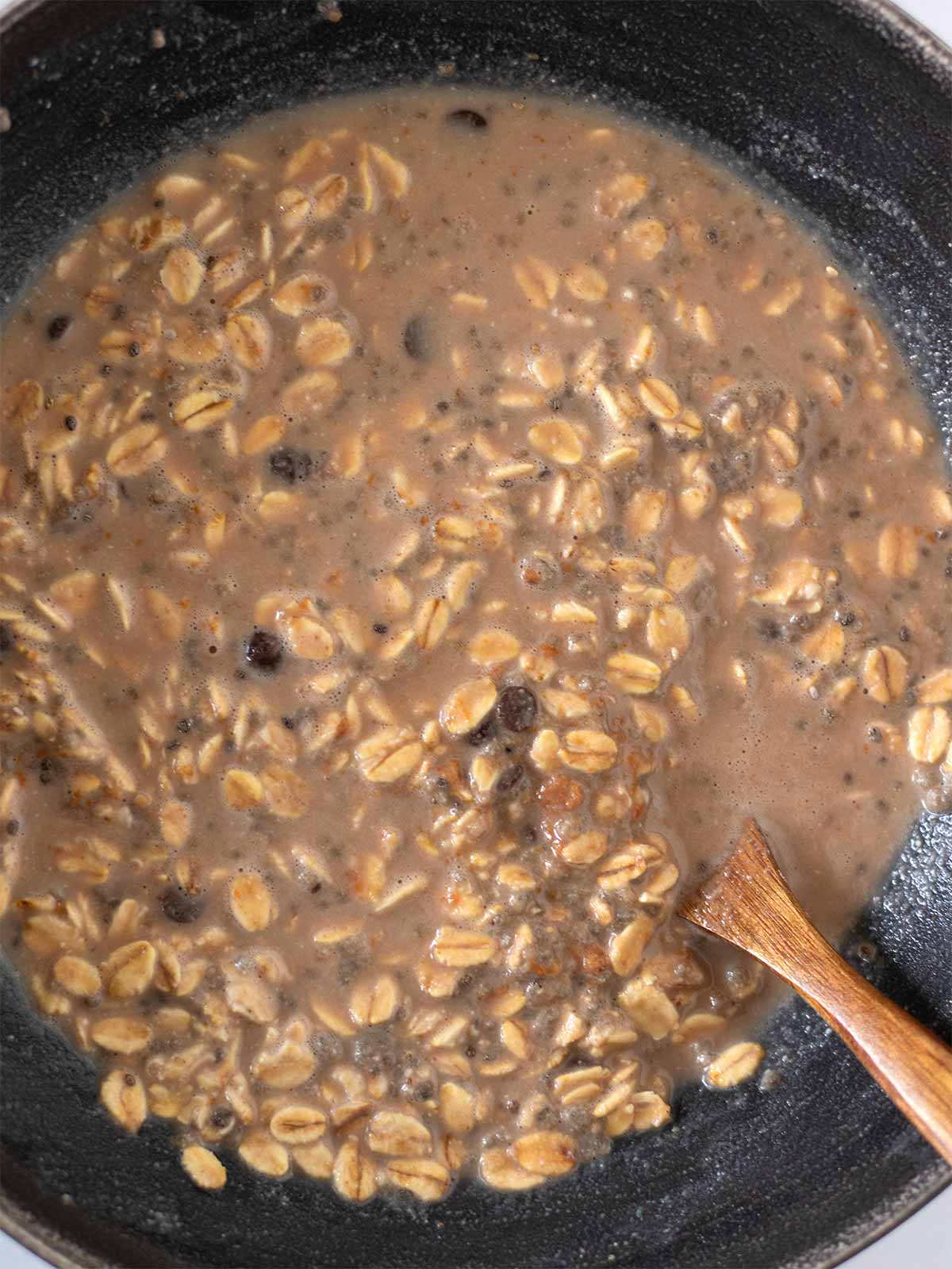 Creamy chilled oatmeal mixture with peanut butter, chocolate chips, and chia seeds.