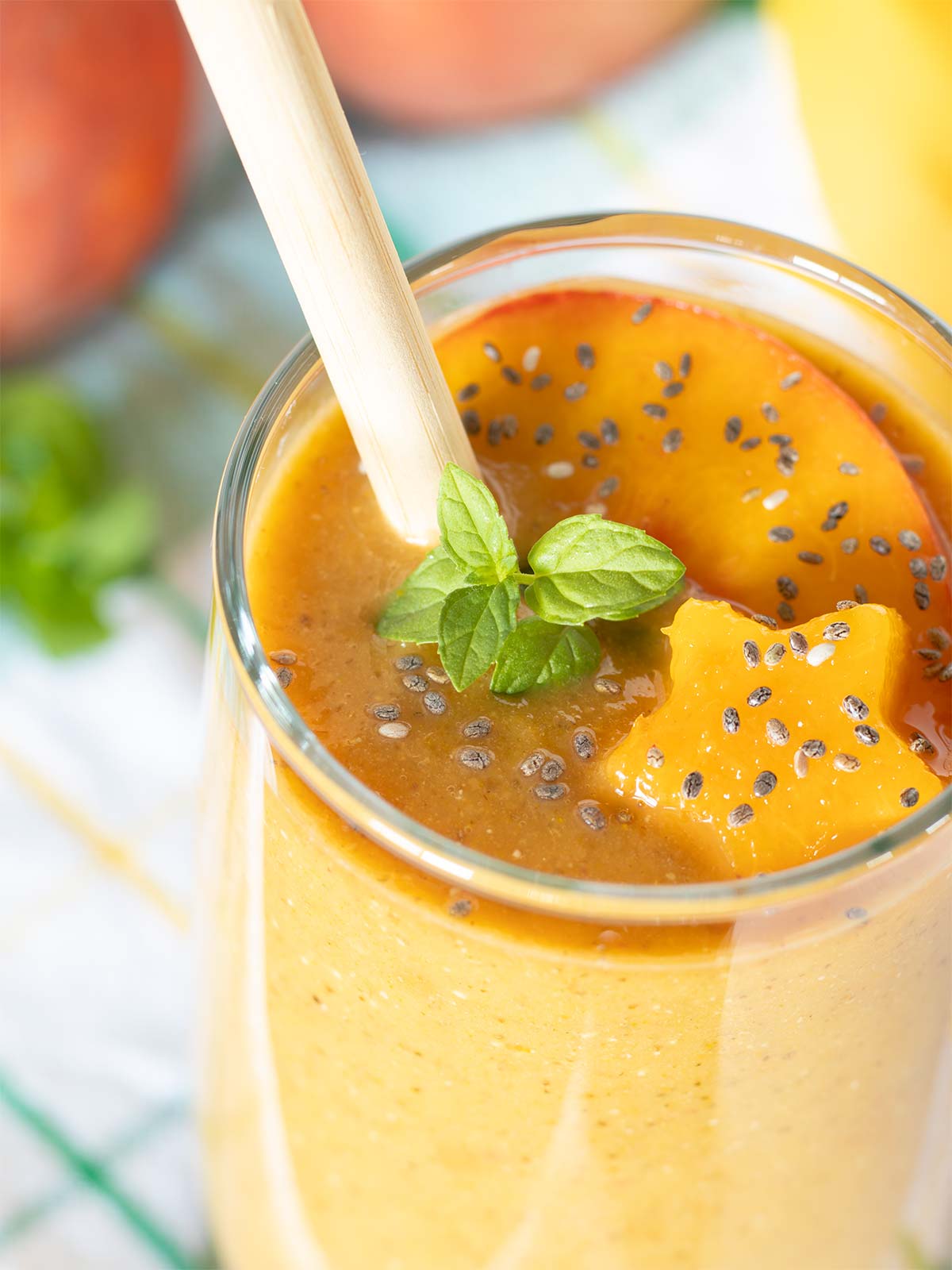 Healthy peach banana almond milk shake in a glass.