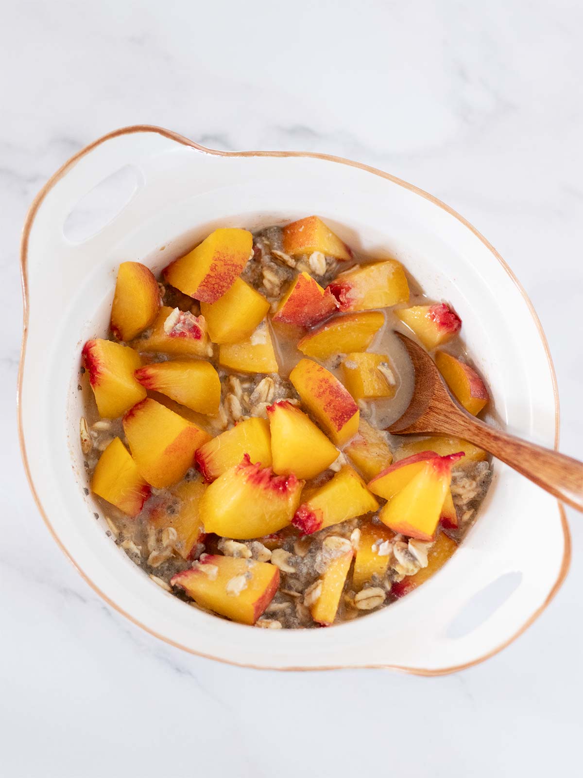 Peach cinnamon chia seeds oatmeal in a bowl.