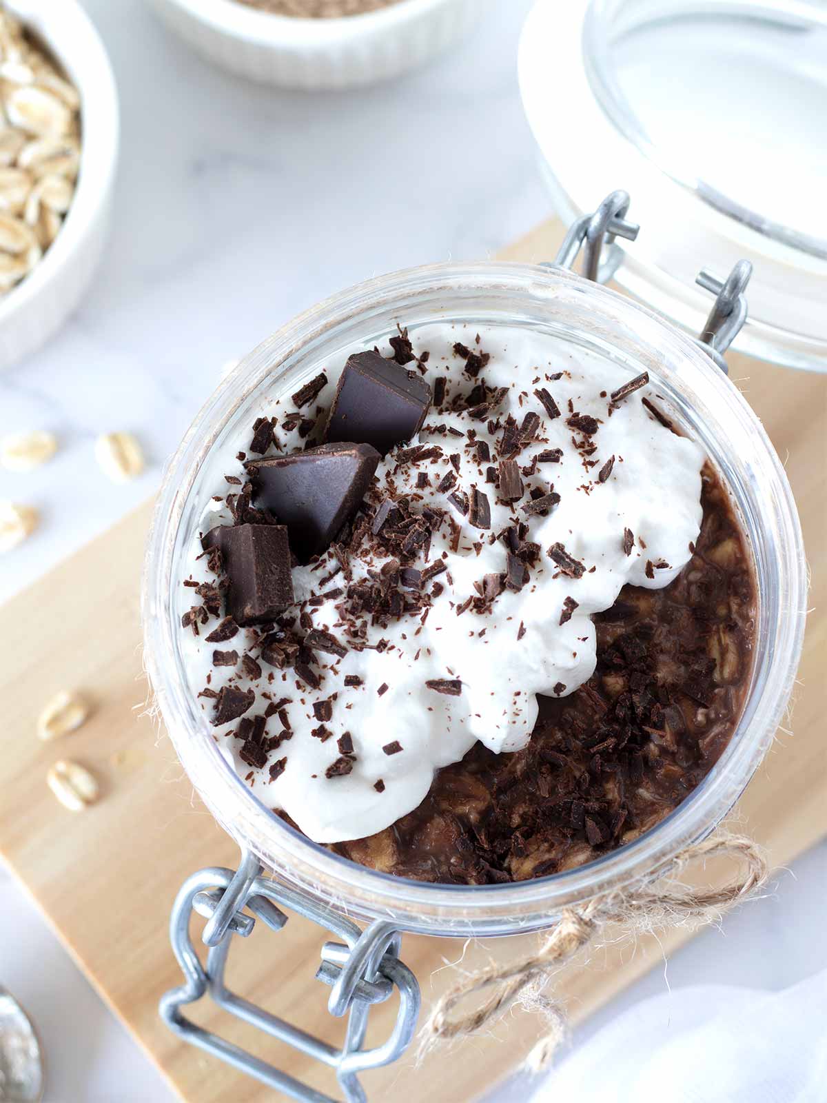 No-yogurt cold chocolate protein oatmeal topped with whipped cream.