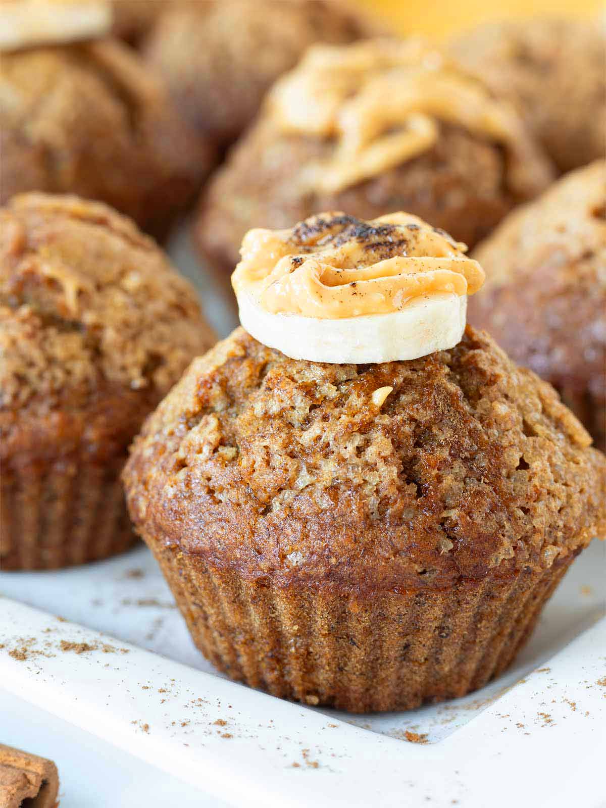 Moist banana breakfast muffins made with cinnamon, brown sugar and oil.