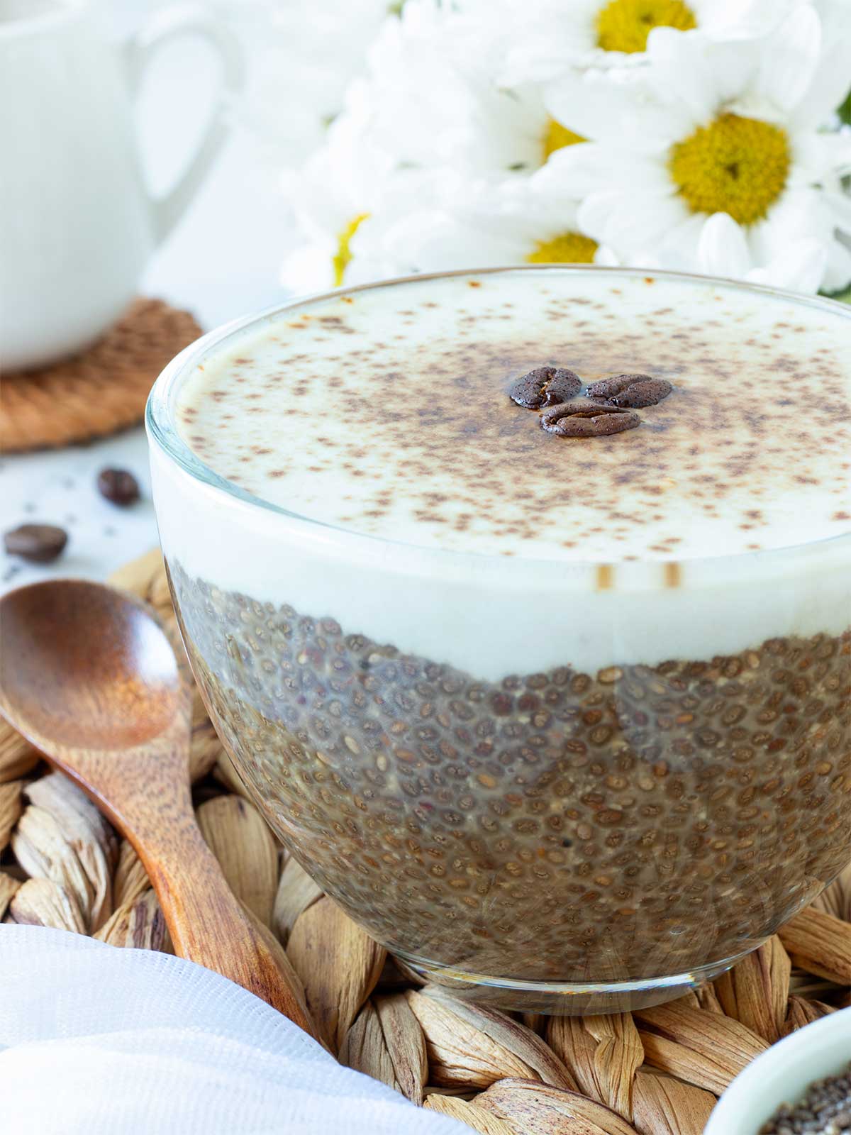 Low-calorie coffee flavored chia pudding topped with dairy-free creamer.