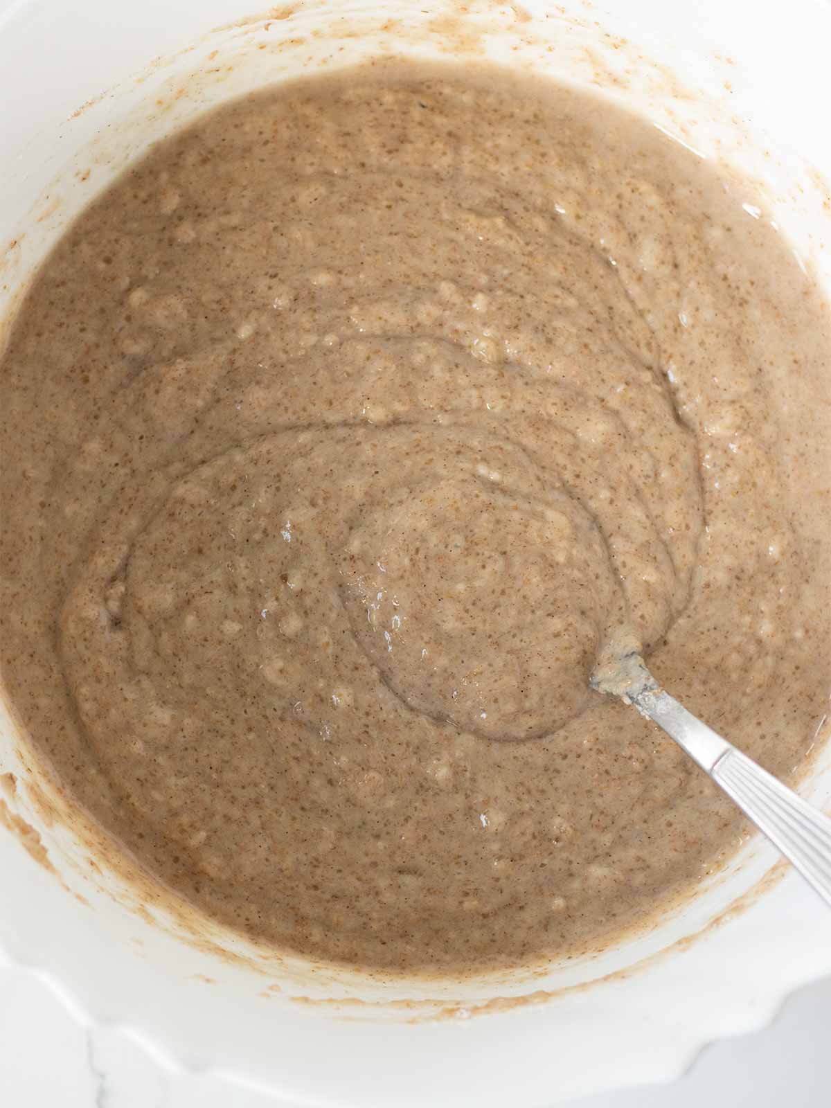 Vegan banana cinnamon muffins batter in a bowl