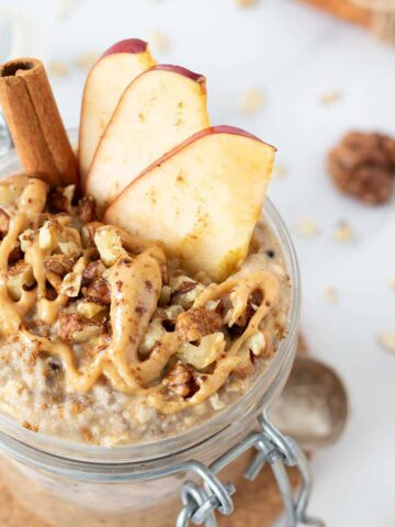 Applesauce overnight oats with cinnamon, peanut butter, and chia seeds for breakfast.