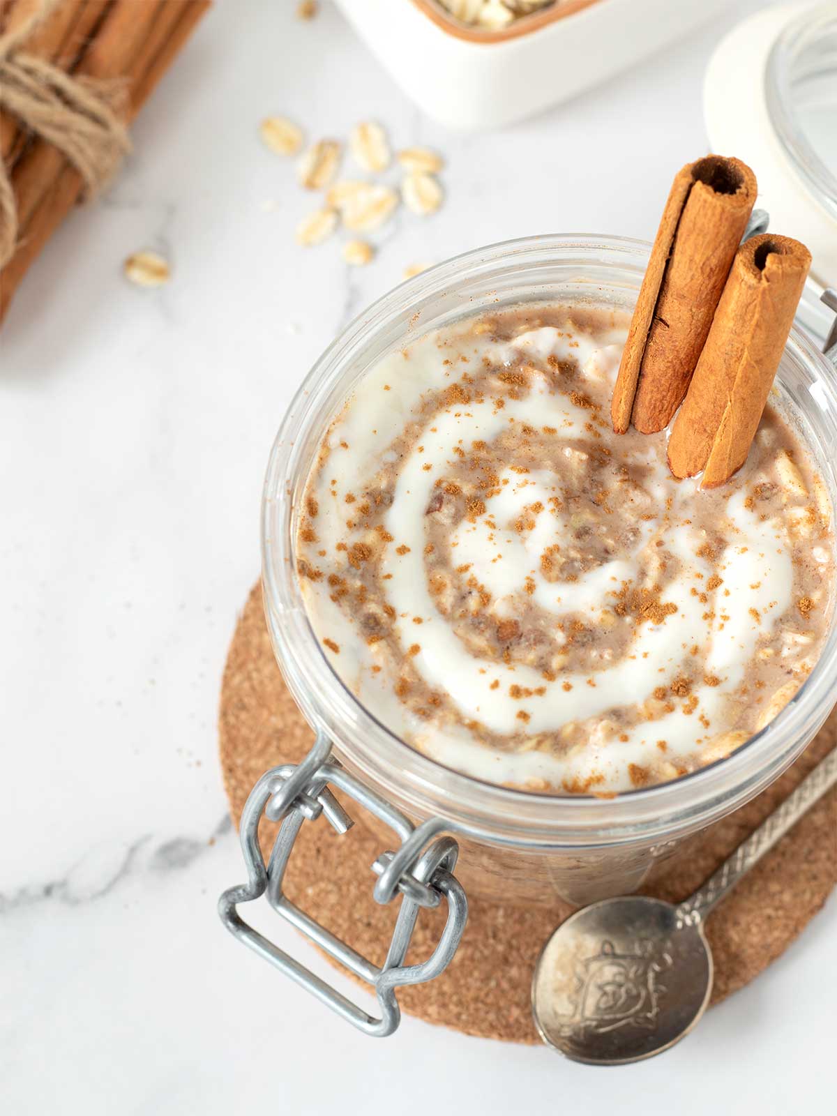 Cinnamon roll overnight oats with brown sugar, chia seeds, and almond milk with healthy protein icing.