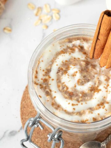 Cinnamon roll overnight oats with brown sugar, chia seeds, and almond milk with healthy protein icing.