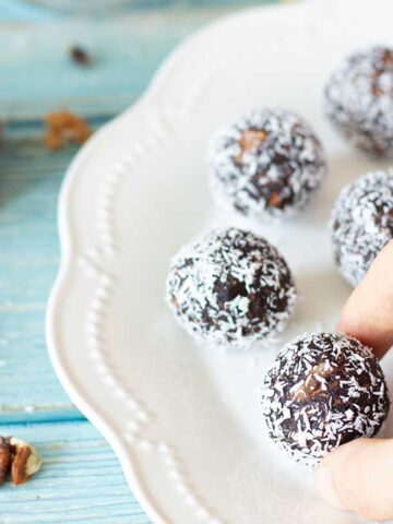 Chocolate walnut date balls with coconut.