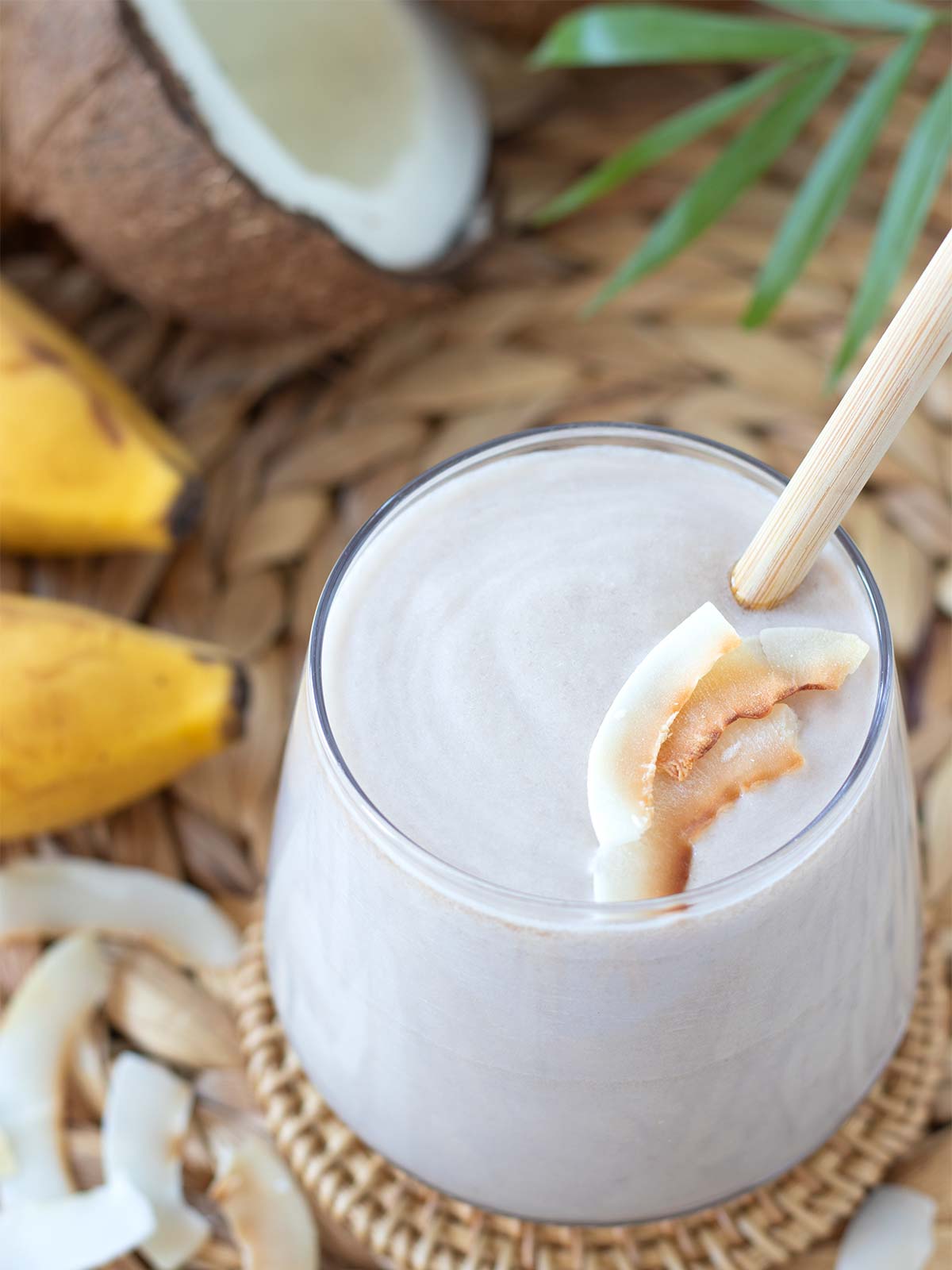 Refreshing summer milkshake with rich coconut flavor topped with toasted coconut flakes.