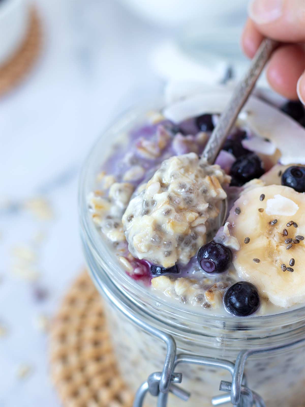 Spoonful of creamy vegan overnight oatmeal.