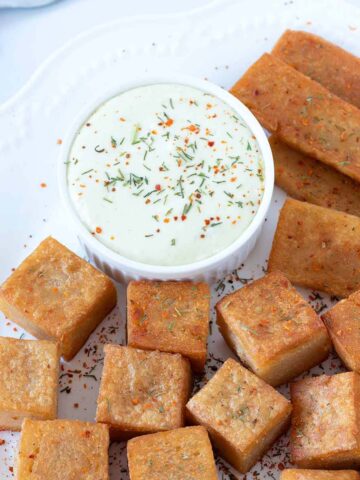 Red lentil tofu (soy-free) cubed, sliced, and fried until golden brown.