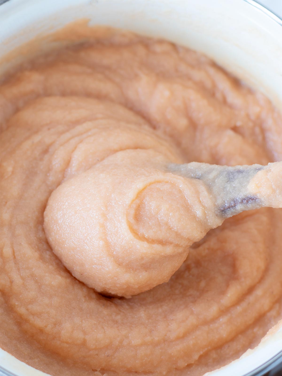 Thick red lentil-water mixture in medium saucepan.