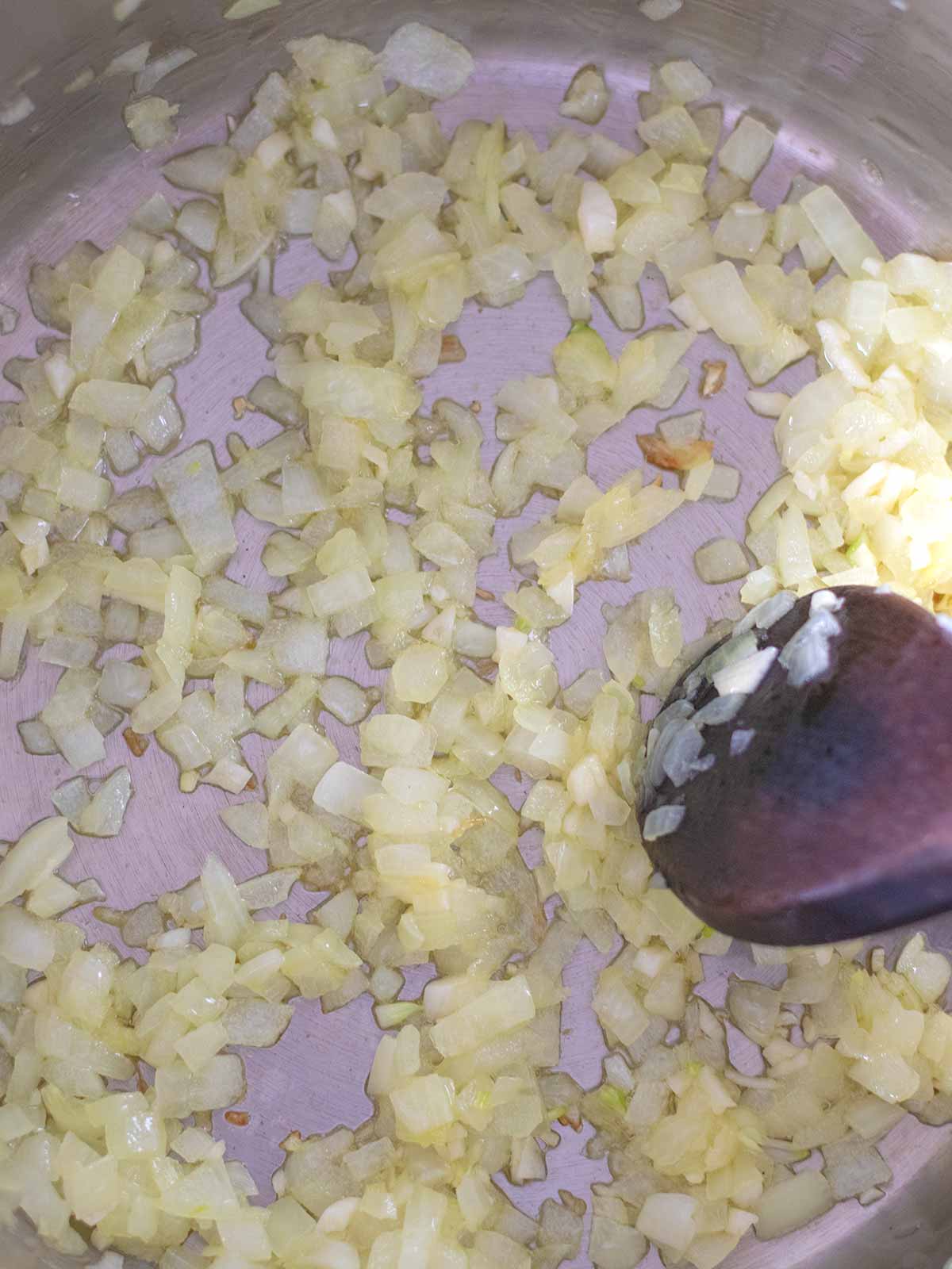 Cooking carrot red lentil soup.