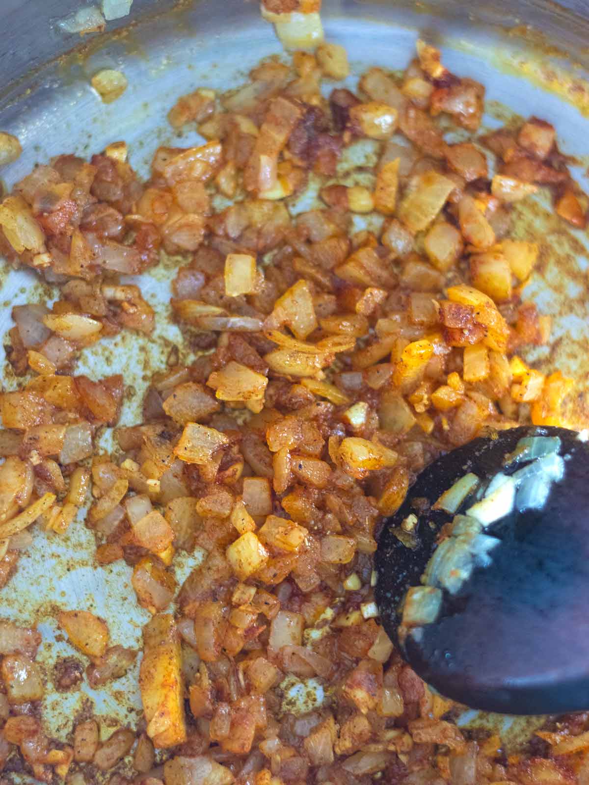 Cooking spiced carrot lentil soup.