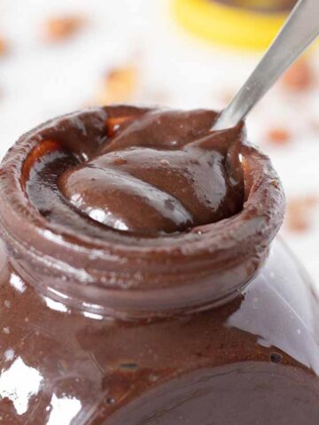 Healthy homemade Nutella with dates, hazelnuts, and cocoa powder.