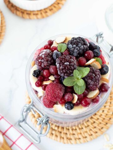 Overnight oats with frozen fruit topped with berries.