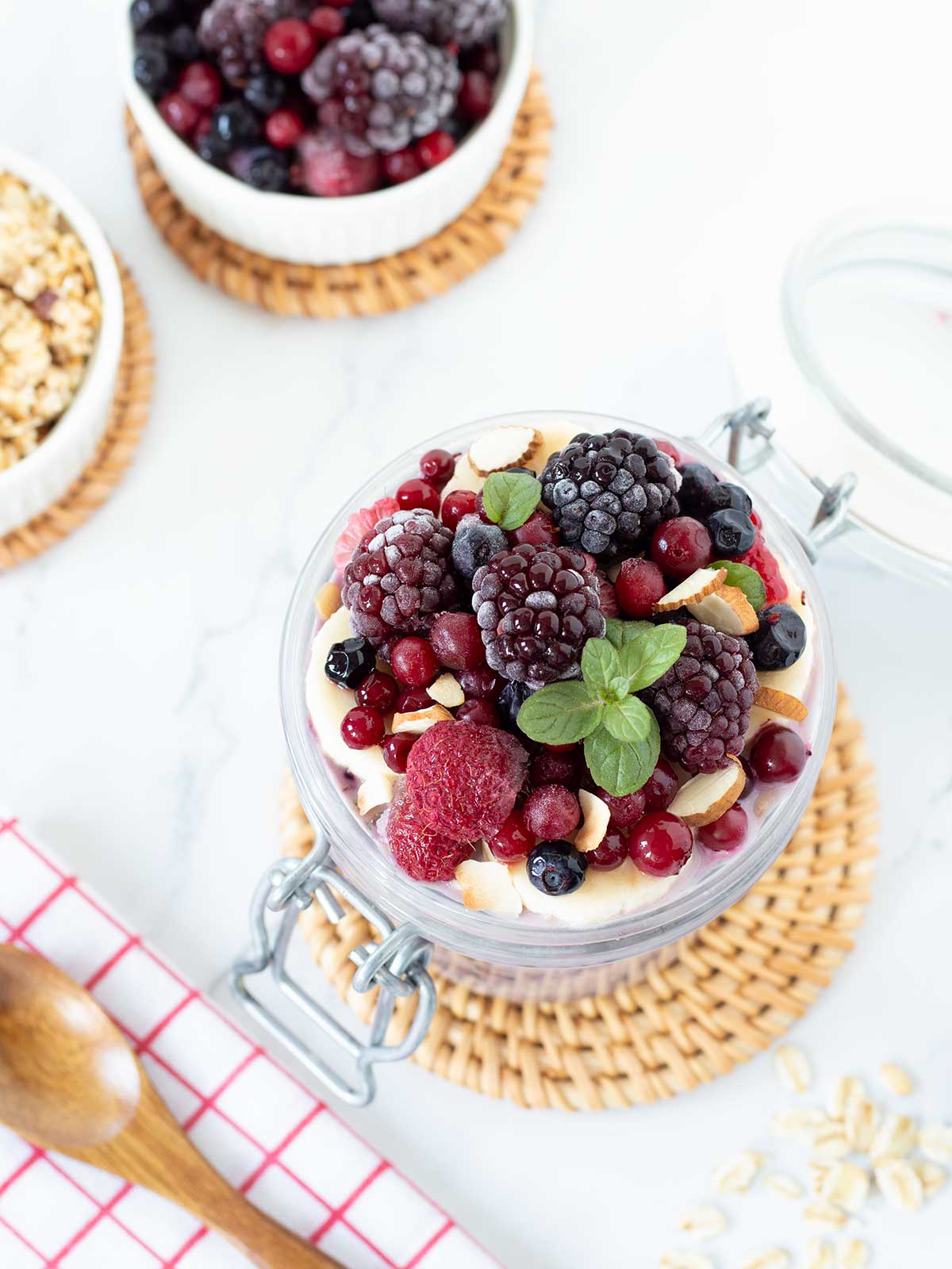 Overnight oats with frozen fruit topped with berries.