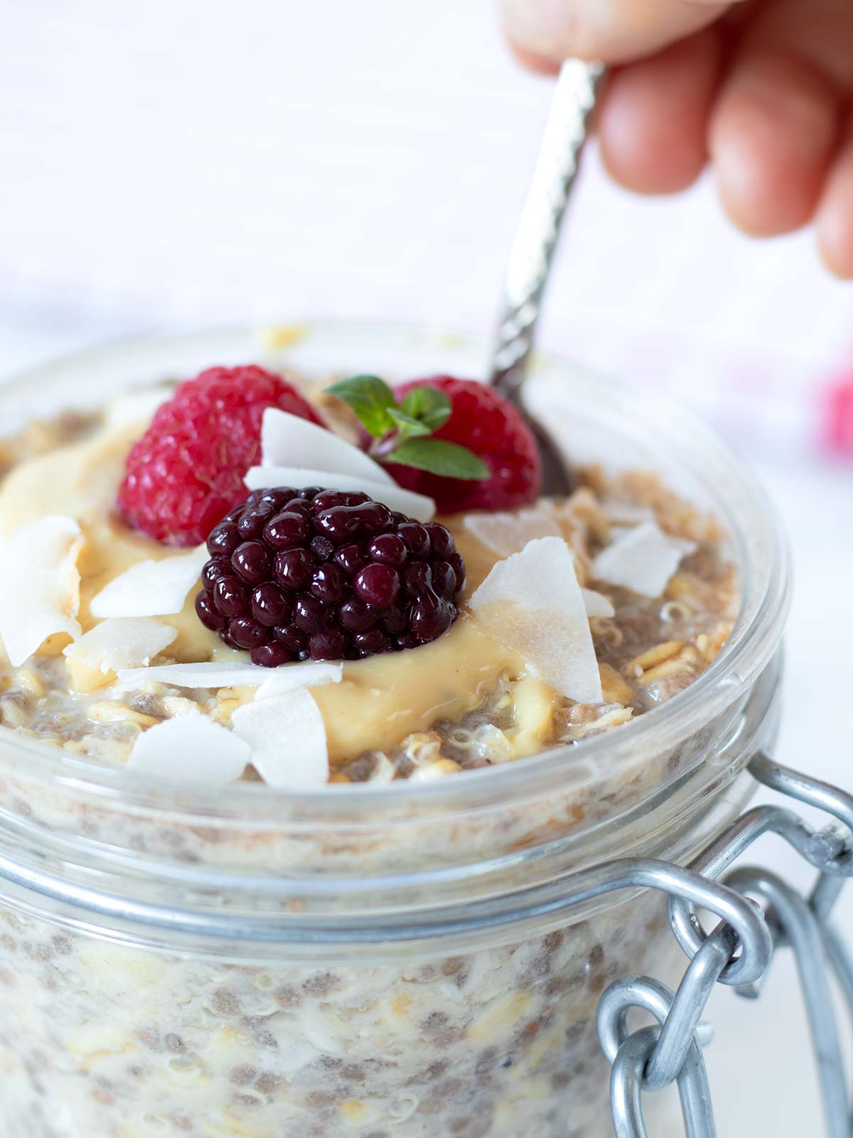 Overnight quinoa breakfast oatmeal with frozen fruit.