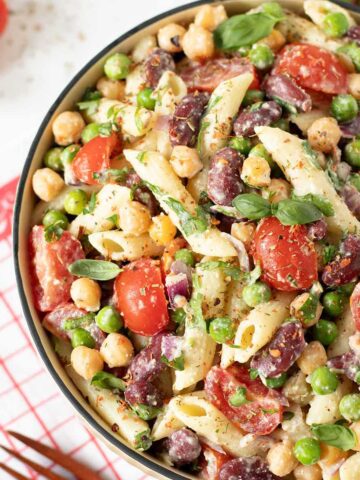 High-protein vegan pasta salad with creamy nutritional yeast dressing.