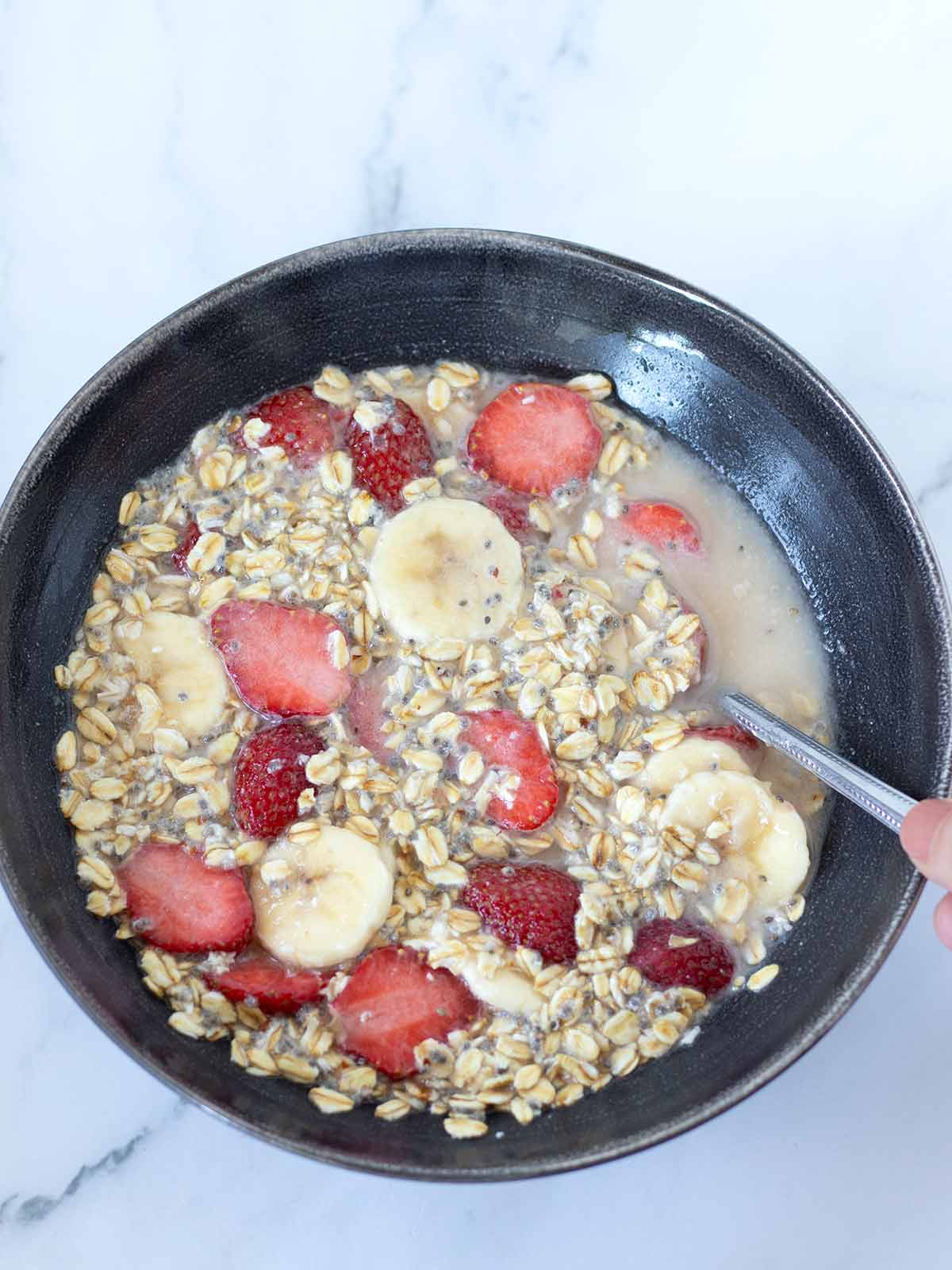 Vegan strawberry banana chia seeds overnight oats in a bowl.