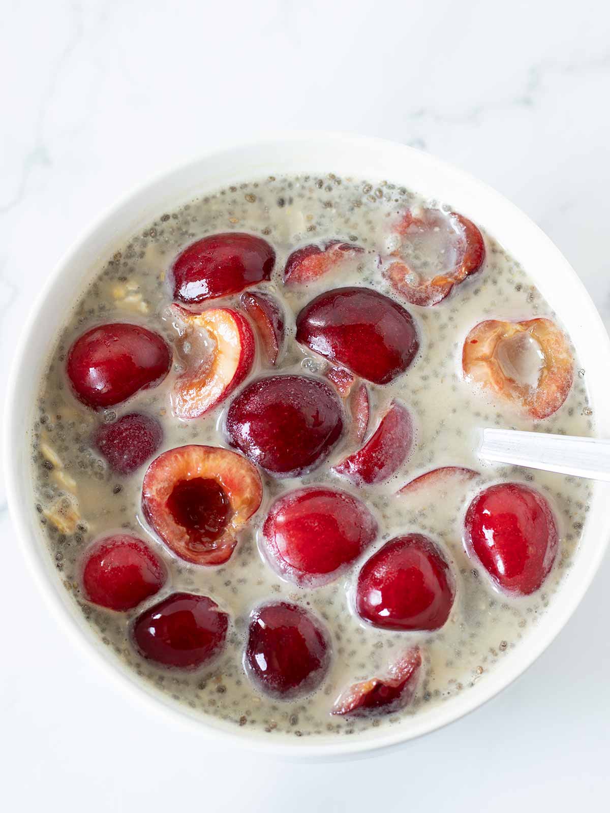 Meal prep of protein cherry overnight oats with chia seeds.