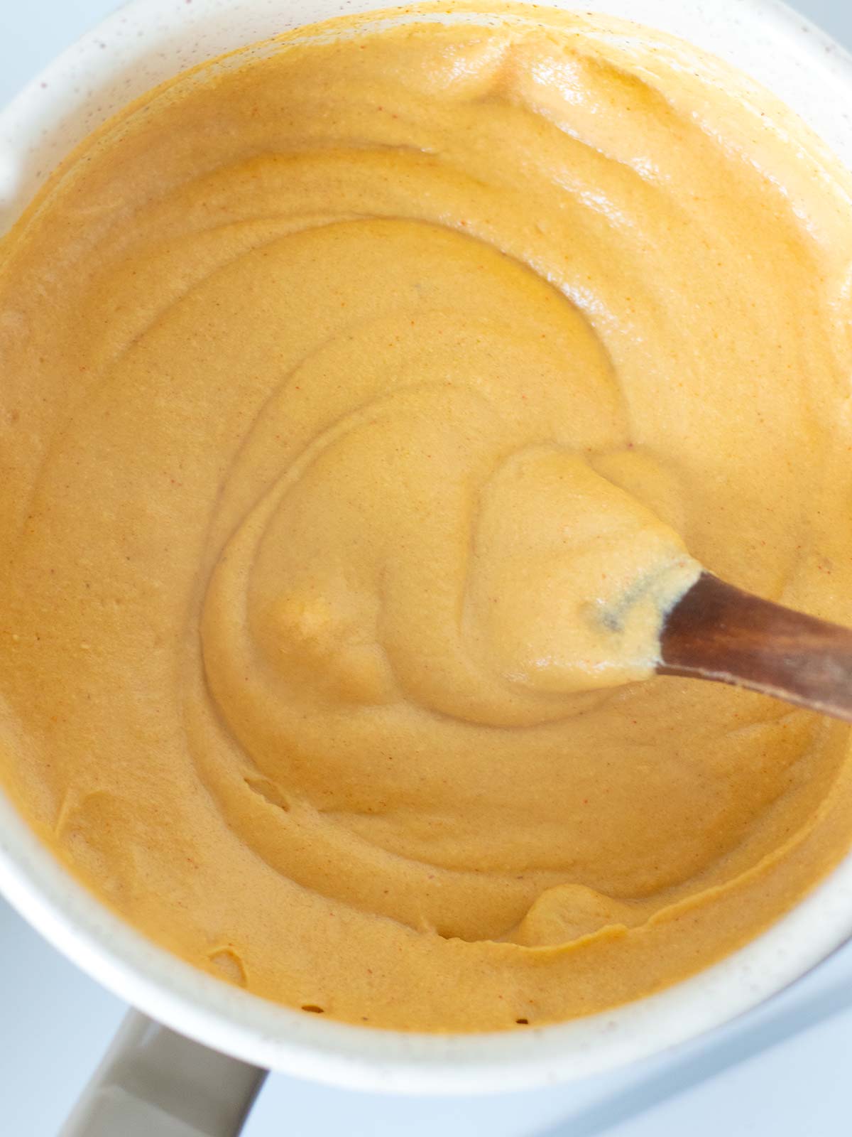 Cooking homemade vegan cheddar cheese.