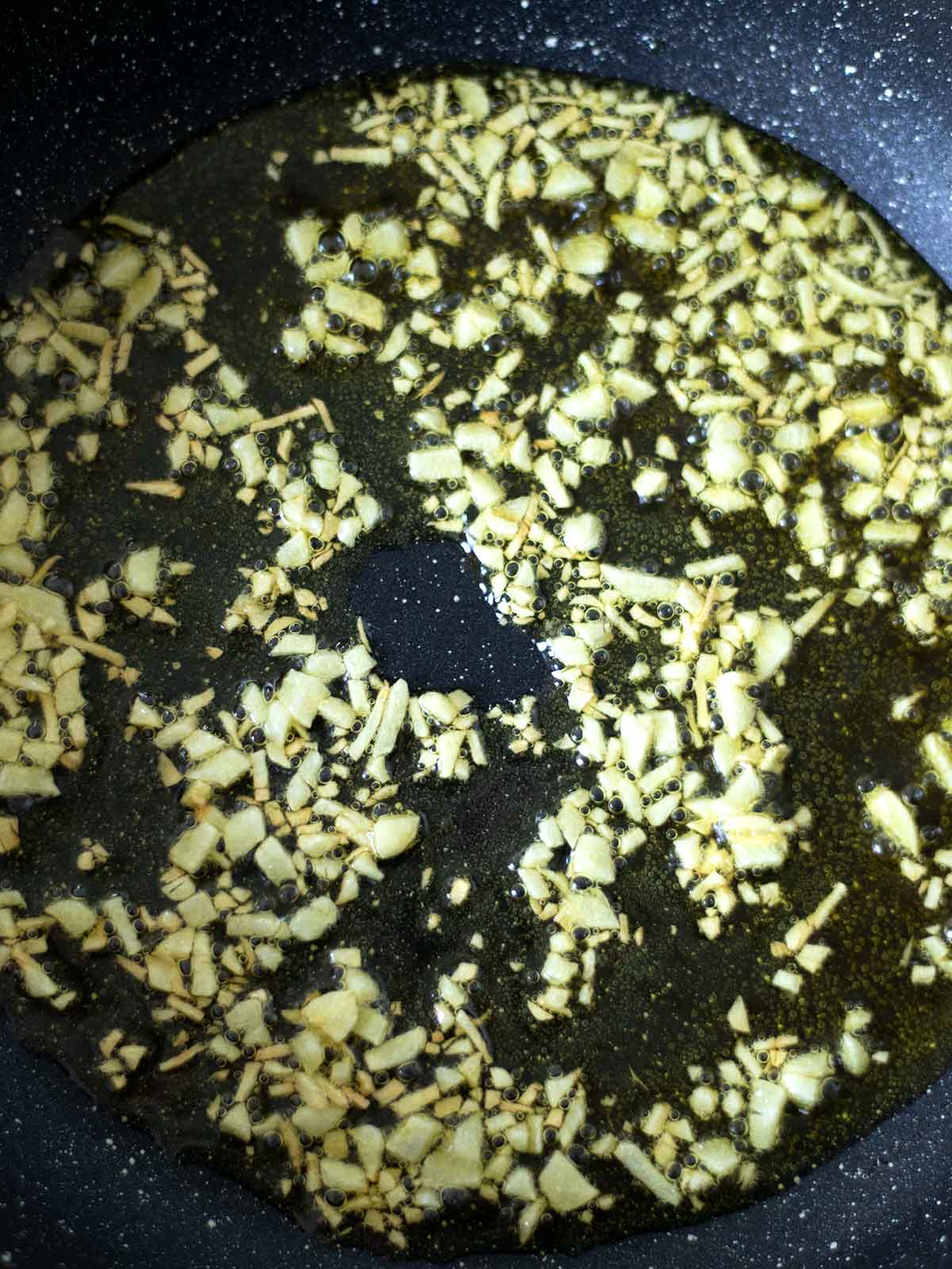 Sauteing garlic for pasta recipe.