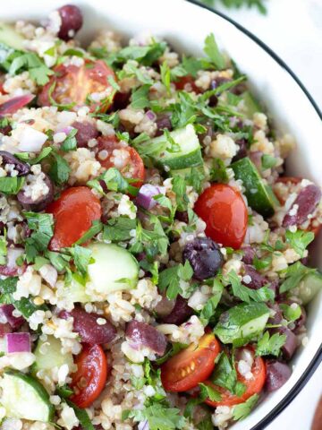 Simple brown rice quinoa salad with red kidney beans, veggies, and lemon olive oil vinaigrette.