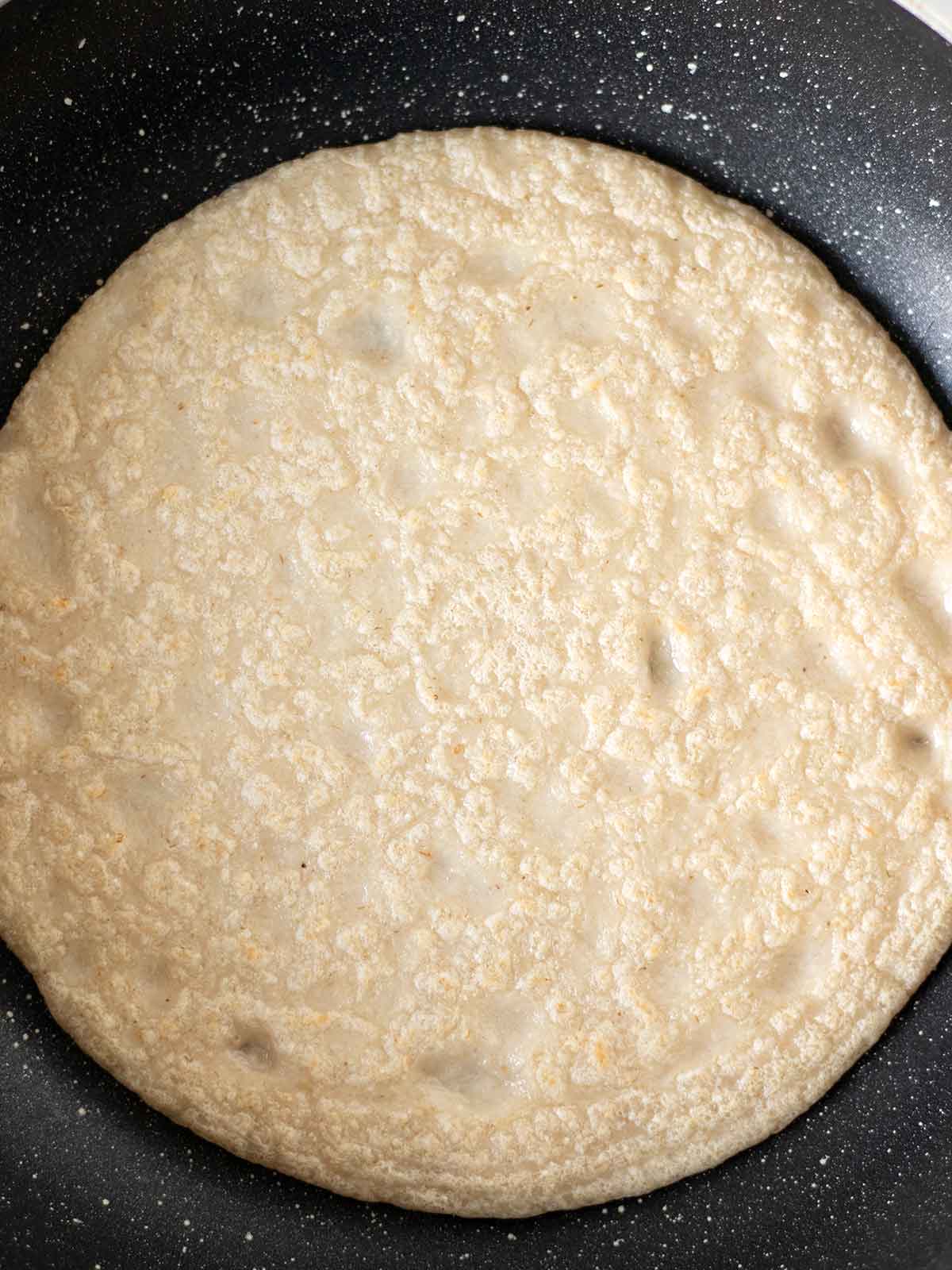 Cooking healthy oatmeal tortillas.