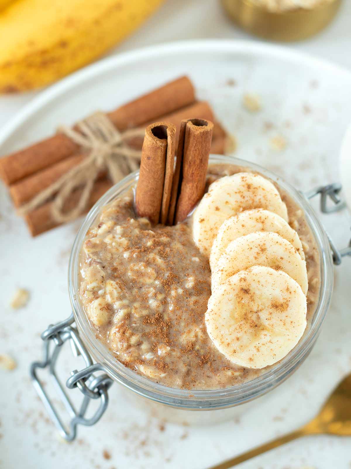 Creamy overnight oats with mashed banana, cinnamon, and peanut butter.