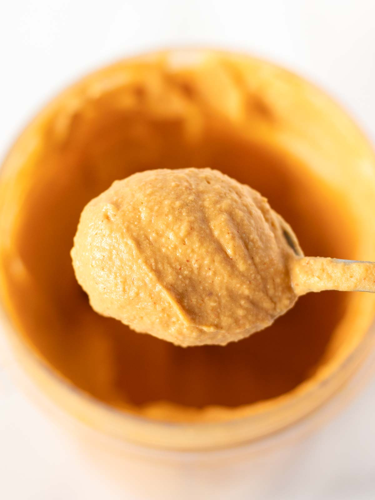 Creamy spoonful of smoked paprika hummus.