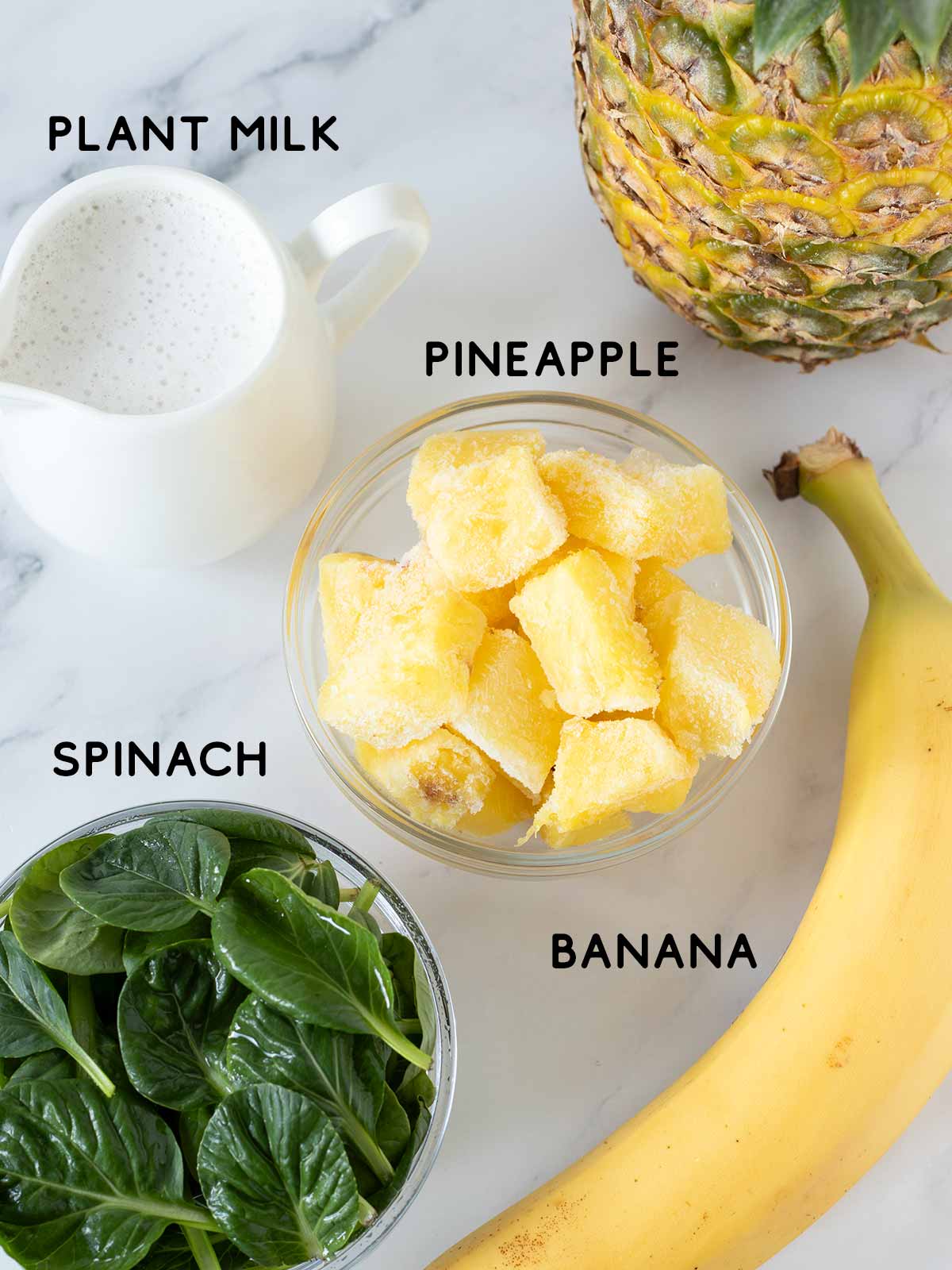 Green spinach pineapple banana smoothie recipe ingredients.