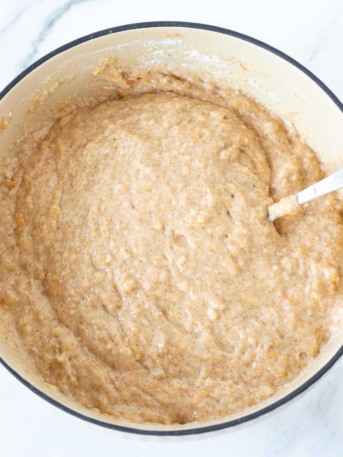 Vegan batter for fluffy pumpkin banana bread muffins.
