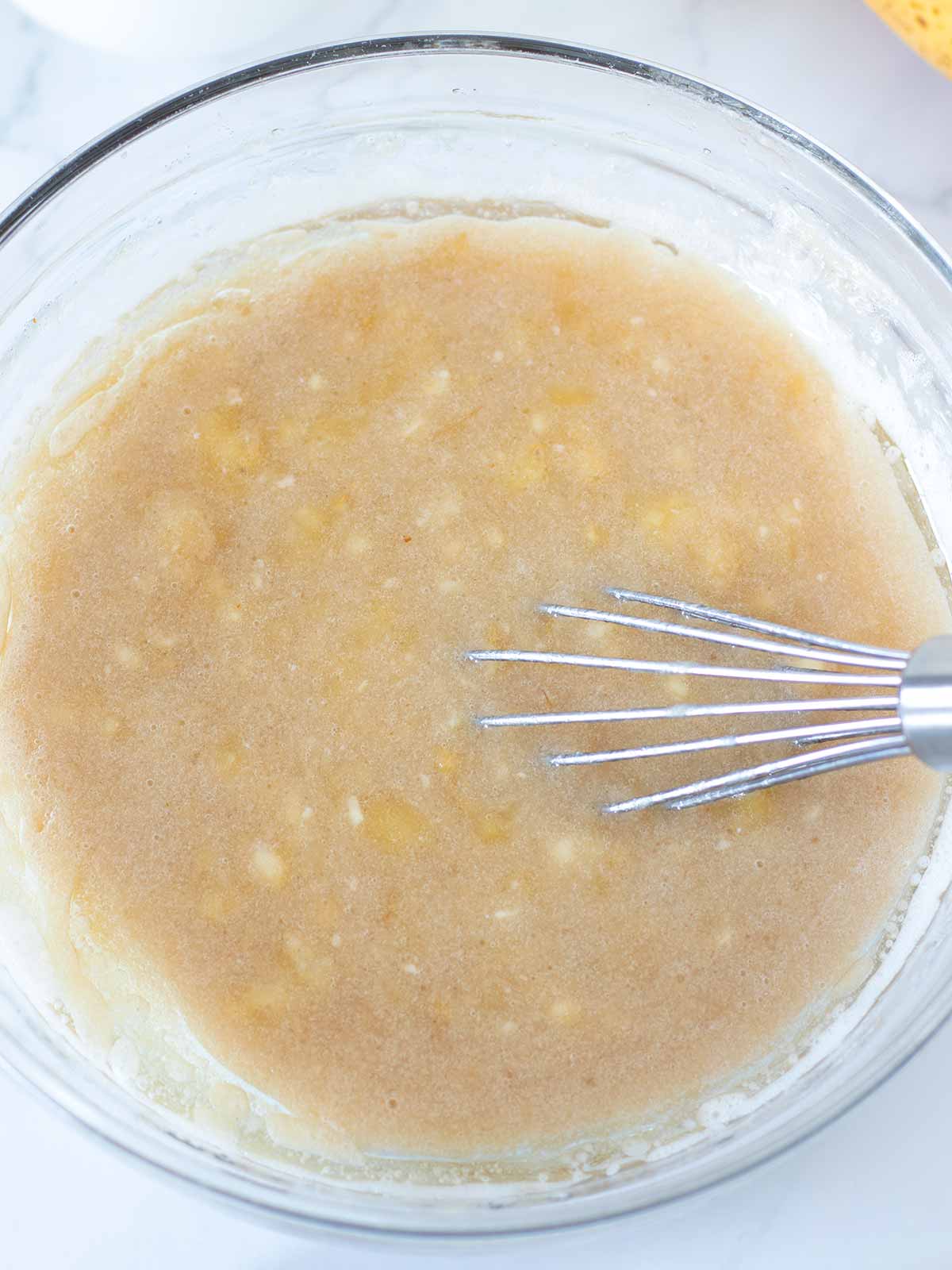 Wet ingredients for vegan banana chocolate chunk muffins.