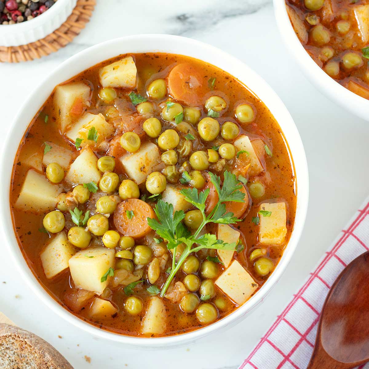 Meatless green peas stew with carrots and potatoes.