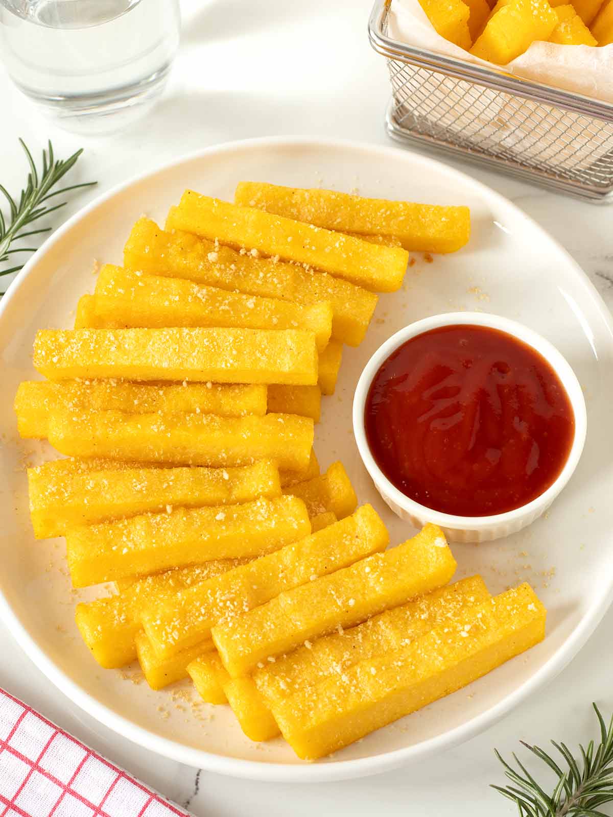 Crispy baked polenta frita sticks.