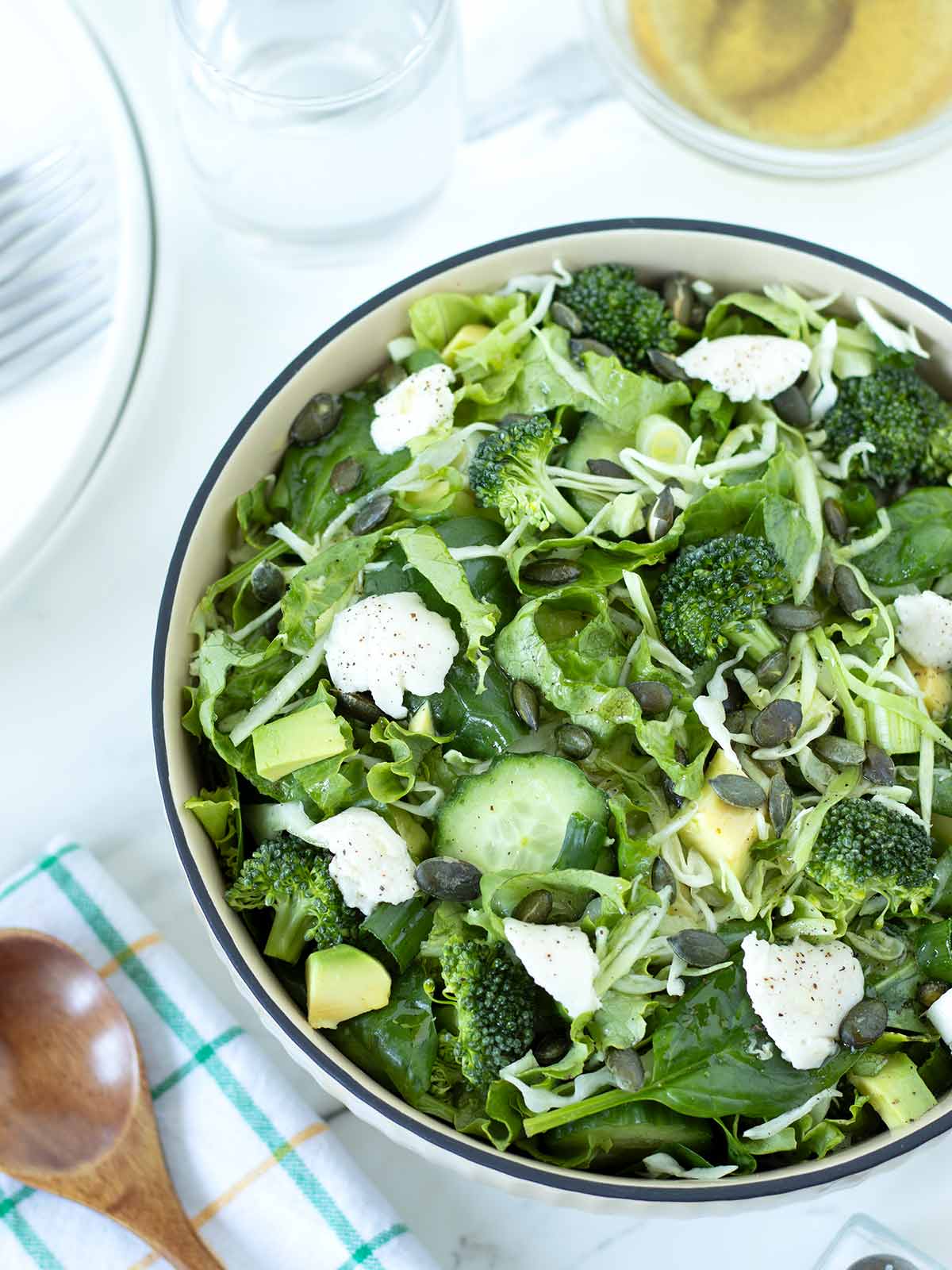 Tossed super green salad with vegan burrata cheese.