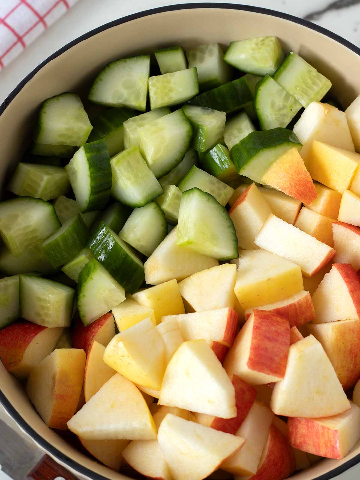 Chopped apples and cucumbers for salad.
