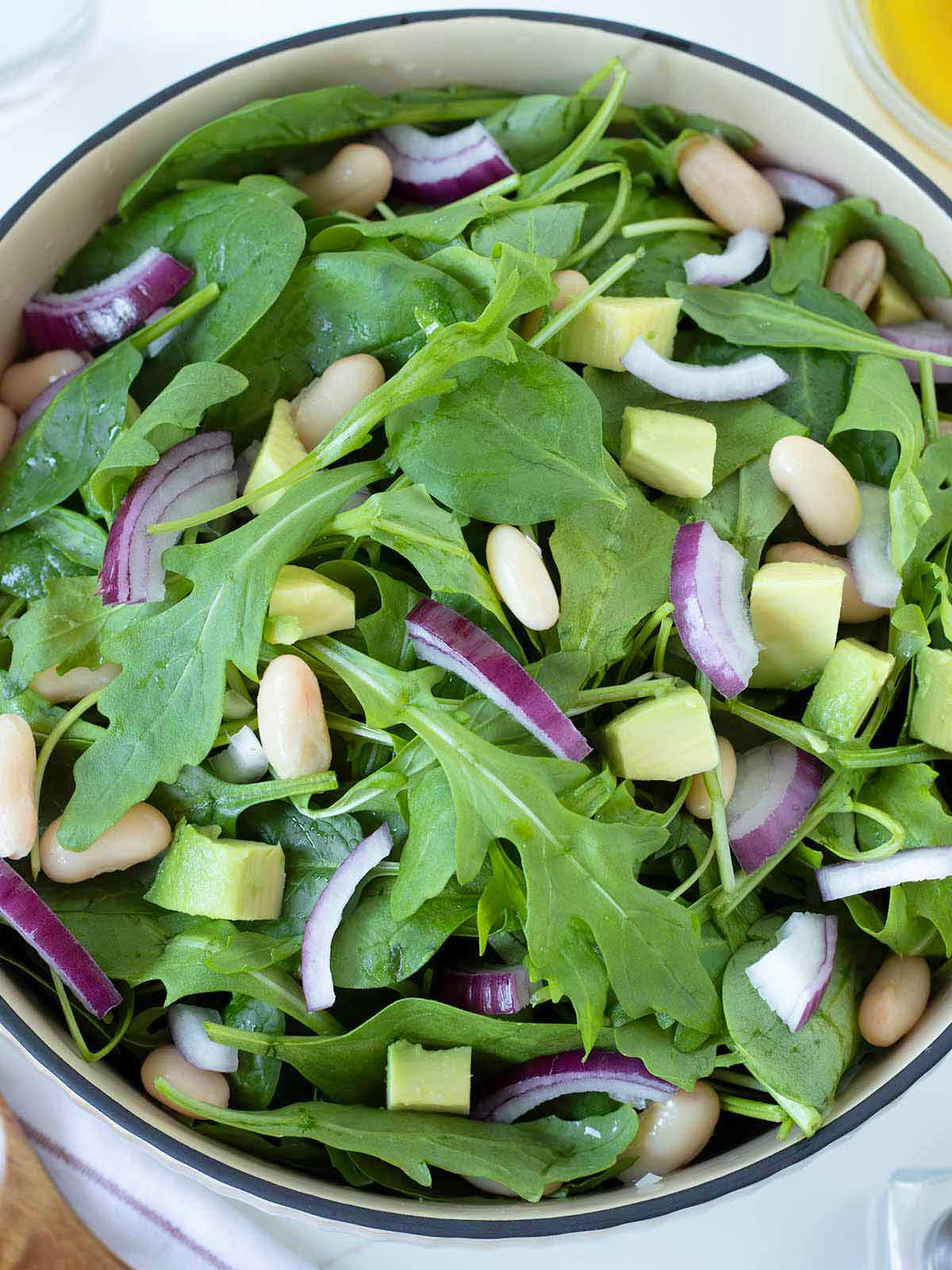 Green spinach and arugula salad in a bowl.