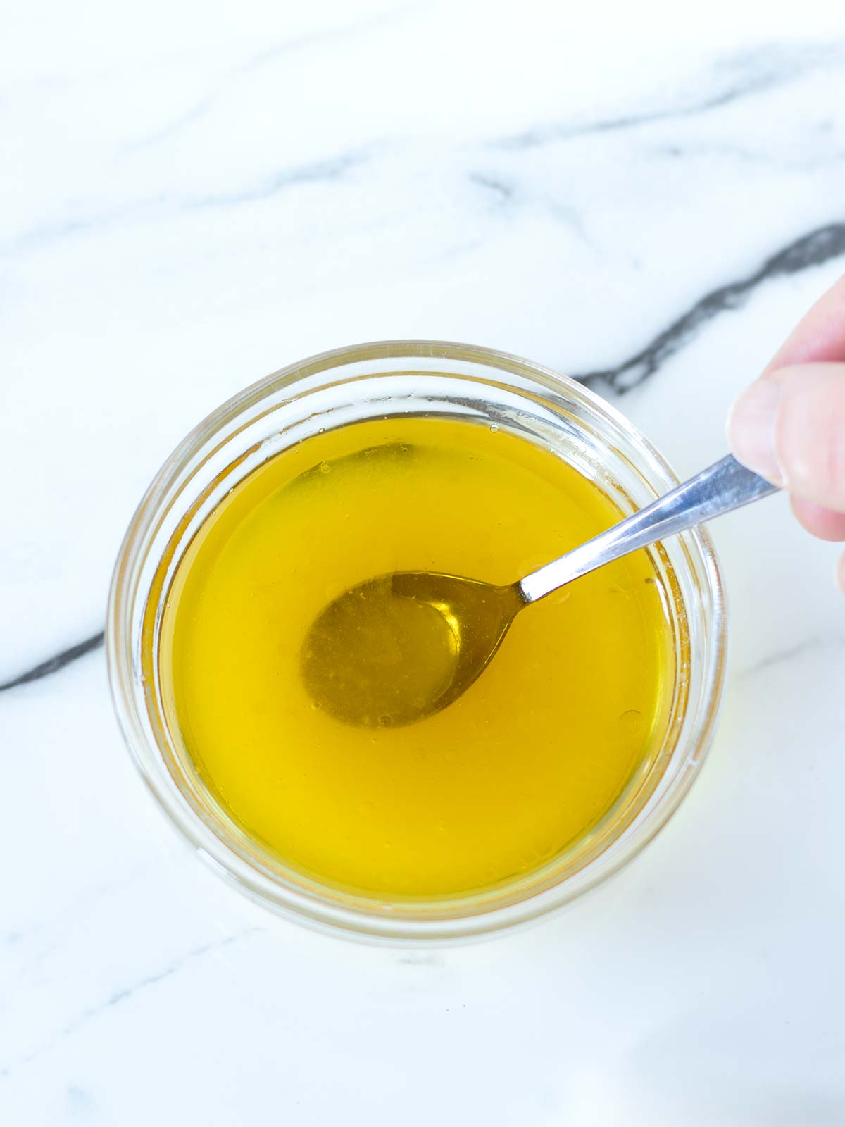 Lemon olive oil dressing for green spinach arugula salad.