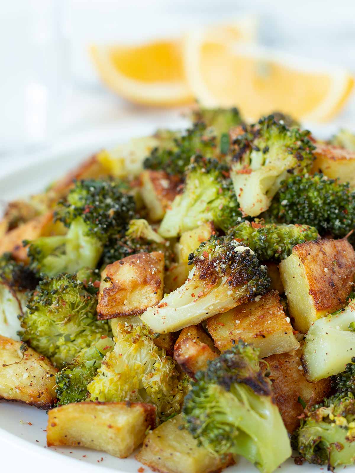 Oven roasted potatoes and broccoli as a vegan side dish or appetizer.
