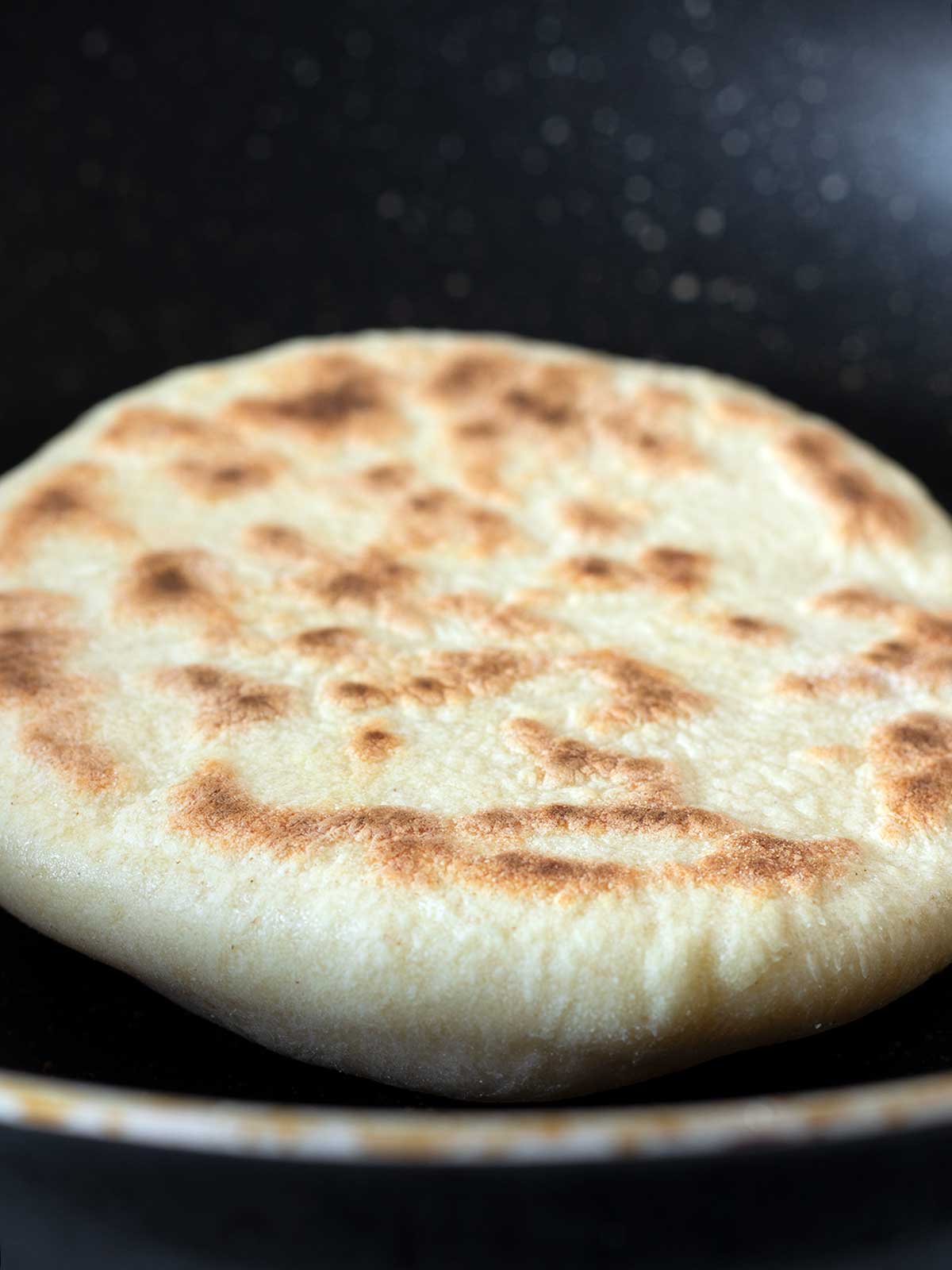 Cooking vegan pita bread.