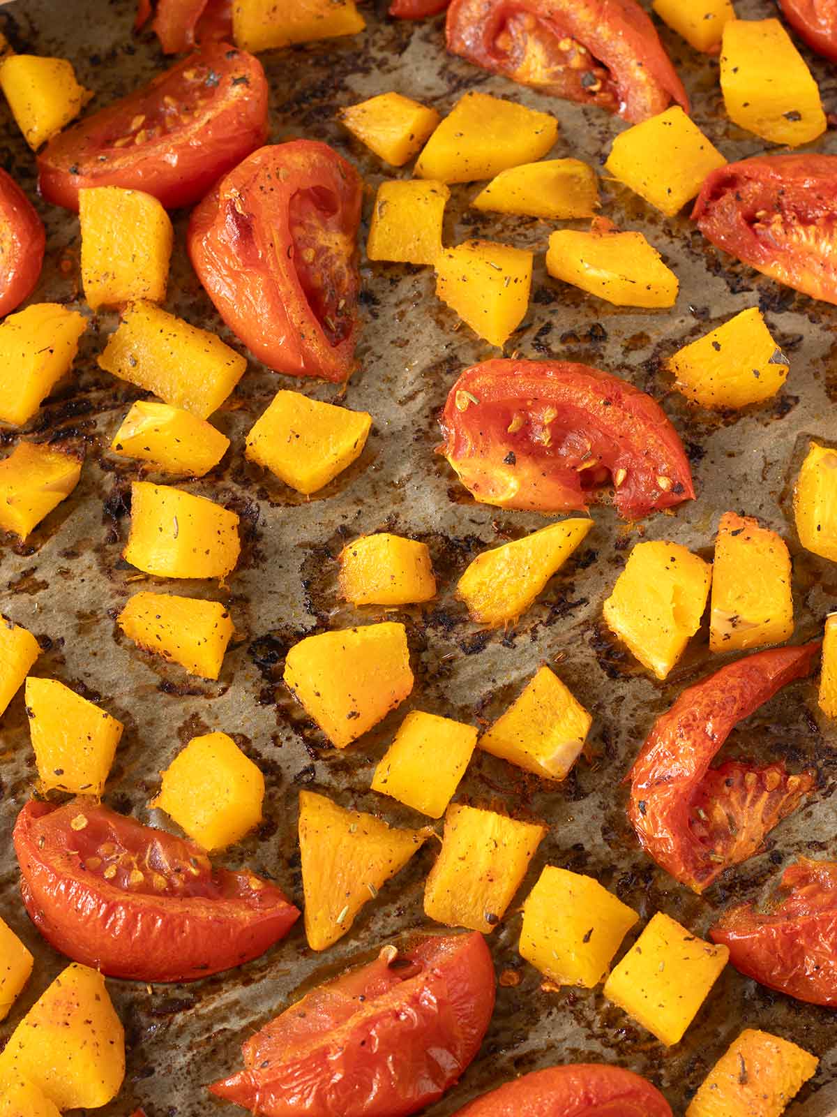Roasted tomatoes and butternut squash for vegan soup.