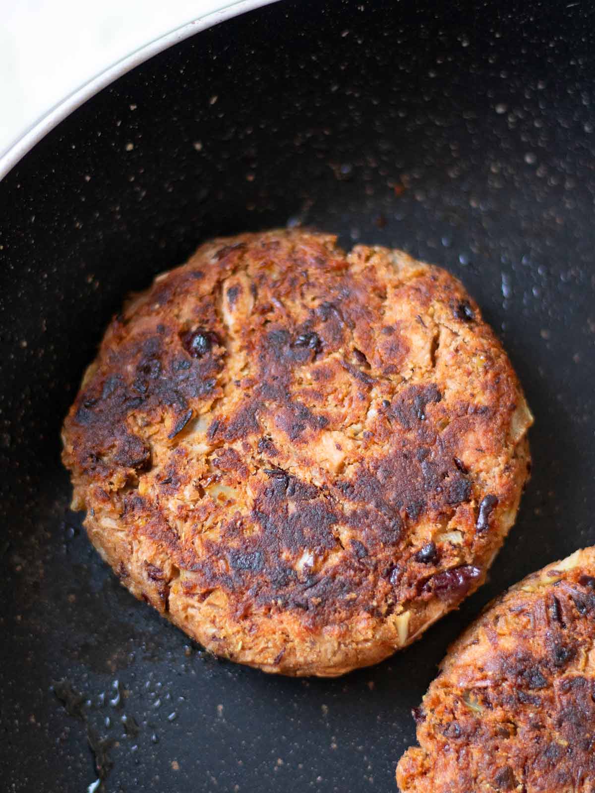 Cooking crispy jackfruit burger patties.