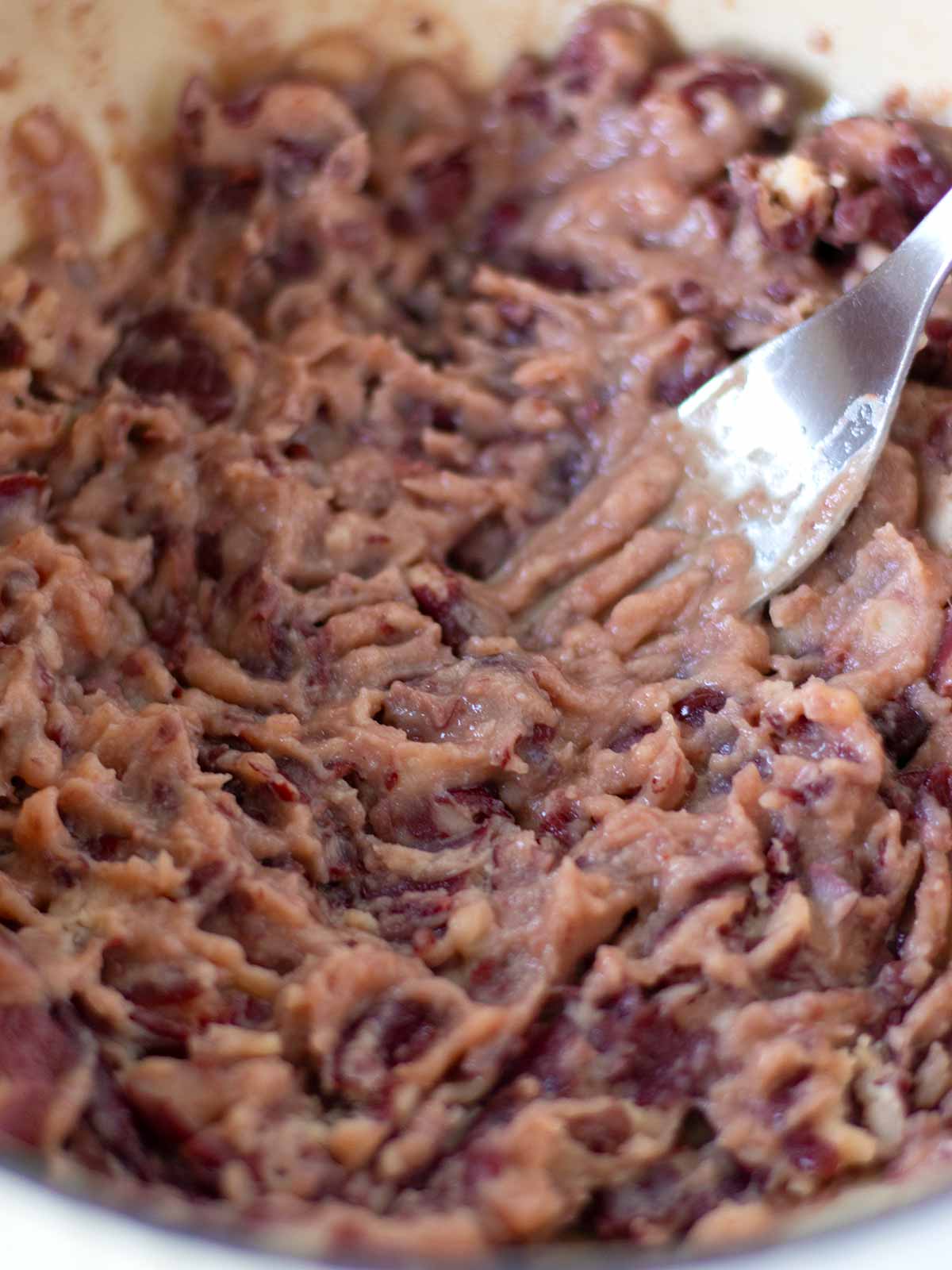 Mashed red kidney beans for vegan jackfruit burger patties.