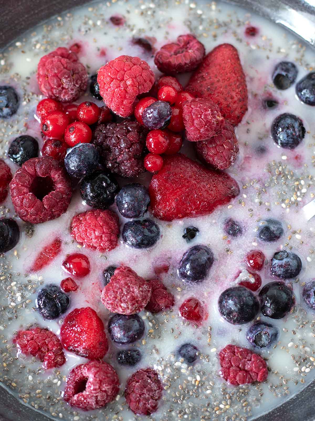 Mixed frozen berries in chia seed mixture.