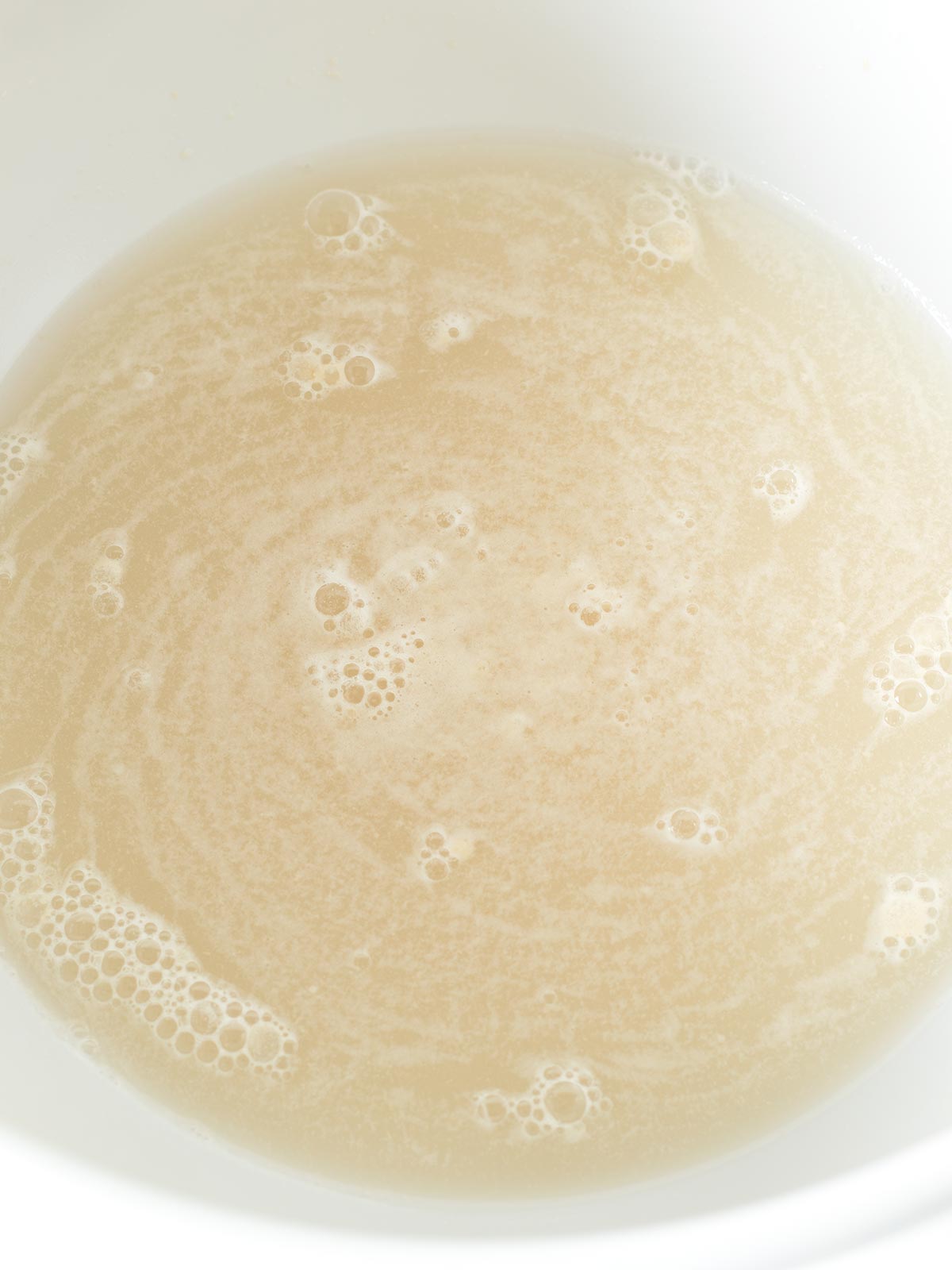 Activating yeast for homemade rustic whole wheat bread.