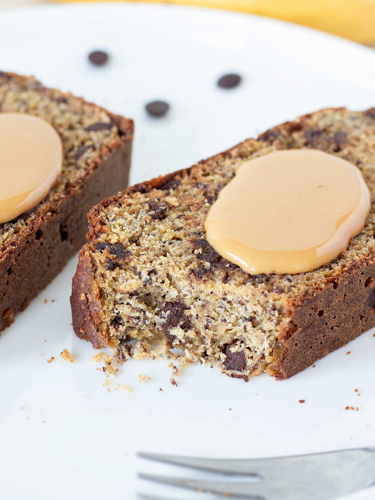 Banana chickpea flour bread topped with peanut butter.
