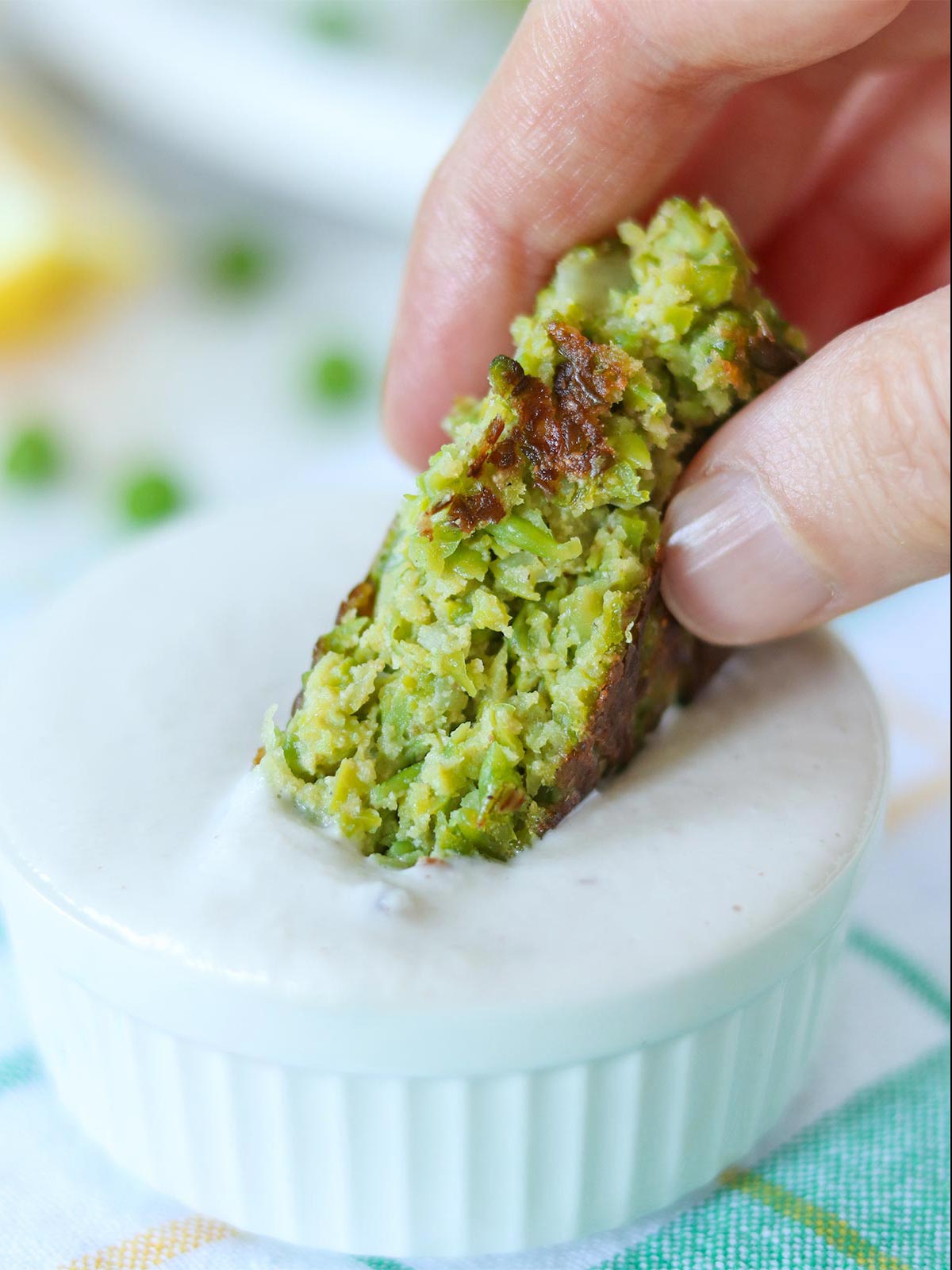Vegan green pea fritter in homemade dairy-free dip.