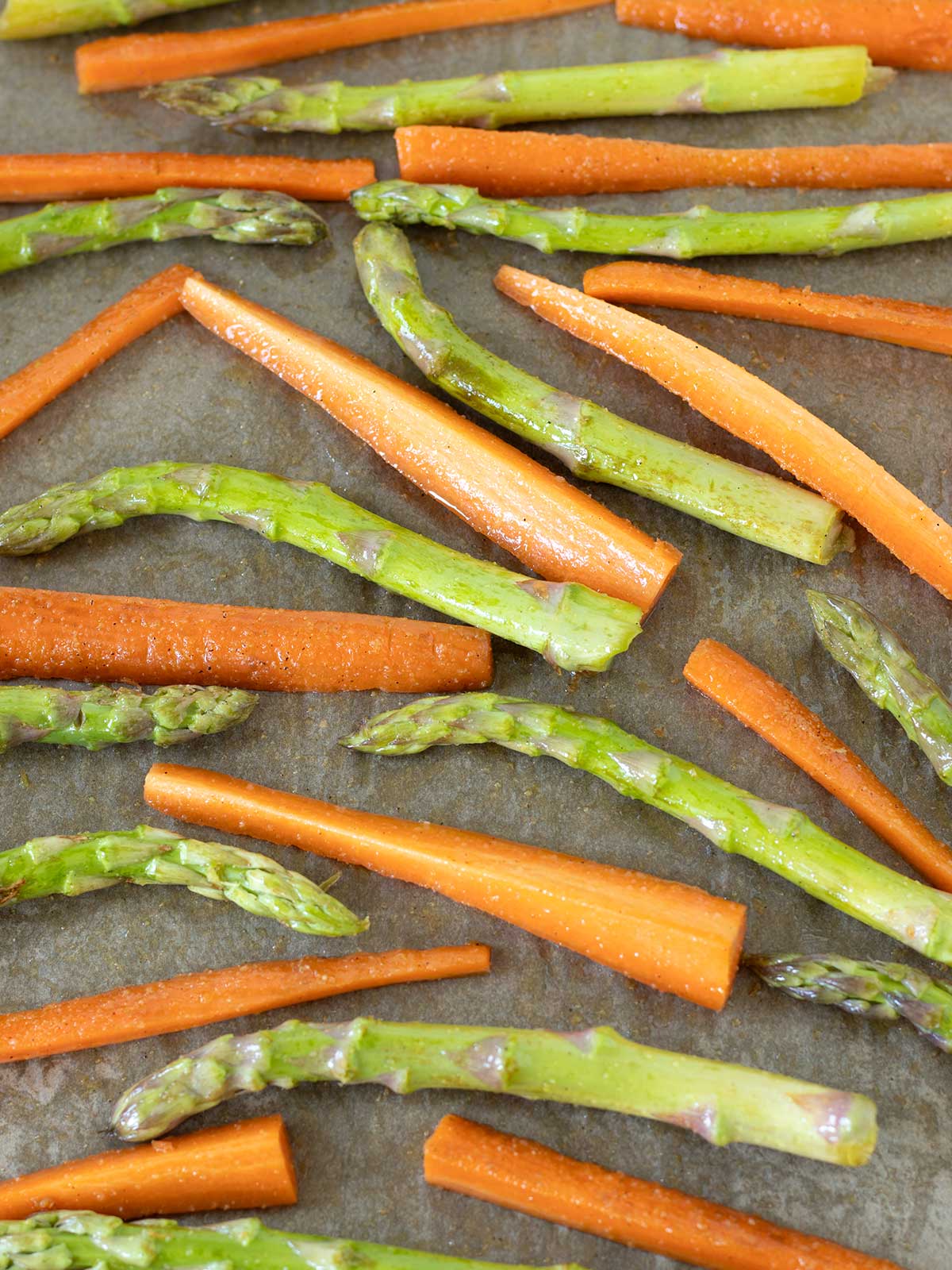 Asparagus and carrots prepared for roasting.